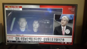 Ms Park was walked into a black sedan and escorted to a convoy, heading to a detention facility near Seoul. Photo taken from a Korean TV in Seoul on Friday 31 March 2017 by Chhay Sophal